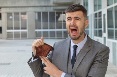 businessman-crying-holding-his-empty-260nw-1034863483.jpg